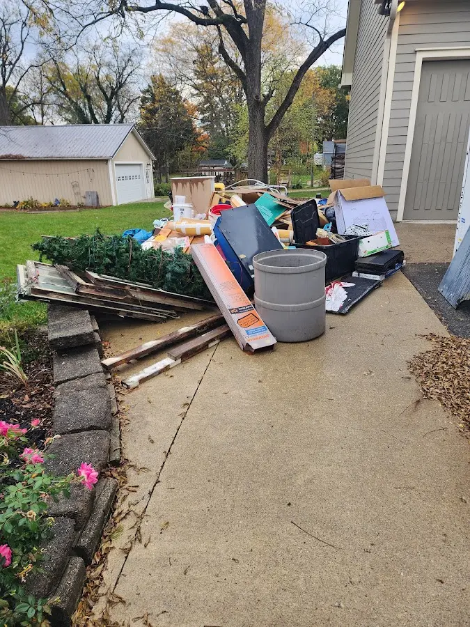 Dumpster being loaded with debris for Demolition Dumpster Rental in North Fayette